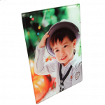 photo of child beside christmas tree